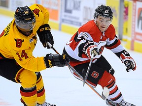 Brett Gustavsen battles Belleville Bulls defenceman Jordan Subban during OHL action last season. Gustavsen was aquired by the Bulls from the Ottawa 67's in a trade Tuesday. (OHL Images)