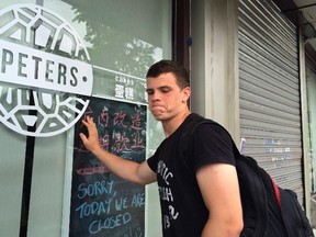 Peter Garratt, one of the sons of Canadian couple Kevin and Julia Dawn Garratt who are being investigated in China for threatening national security, stands outside his parents' coffee shop as he talks to Reuters journalists in Dandong, Liaoning province, August 6, 2014. (REUTERS/Ben Blanchard)