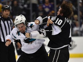 Los Angeles Kings centre Mike Richards (10) and San Jose Sharks centre Logan Couture (39) fight during the third period in Game 6 of the first round of the 2014 Stanley Cup Playoffs at Staples Center. (Kelvin Kuo-USA TODAY Sports)