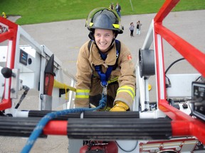 Alanah Brannigan makes her way up a 50-foot ladder July 30 in London, Ont. GERARD CRECES\SPECIAL TO THE LONDONER