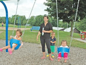 Jolene Keyser, of Mitchell, often brings children Pyper, Trayton and Berkley to the playground and swings area at the Lions Park in Mitchell. Keyser appreciates the Mitchell Optimist Club and the work they have done for projects like the new playground equipment. KRISTINE JEAN/MITCHELL ADVOCATE
