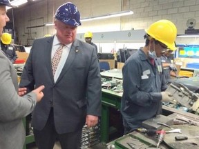 Mayor Rob Ford tours an electronics recycling company in Scarborough on Wedesday, Aug. 6. (VERONICA HENRI/Toronto Sun)