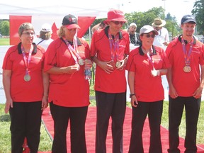 Corey Mulholland, right, with his A Division championship fivepin bowling team at the 2014 Special Olympics Canada Summer Games. (CONTRIBUTED PHOTO)