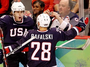 USA's Patrick Kane and Brian Rafalski  celebrate one of Kane's two first period goals during action of Olympic men's hockey semifinal playoffs at GM Place in Vancouver, B.C. ANDRE FORGET/QMI AGENCY