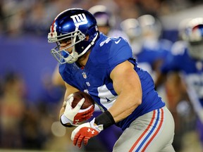 Running back Peyton Hillis #44 of the New York Giants runs with the ball against the Minnesota Vikings. Maddie Meyer/Getty Images/AFP