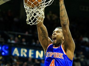 New York Knicks power forward Jeremy Tyler (4) dunks in the first half against the Atlanta Hawks at Philips Arena. Daniel Shirey-USA TODAY Sports