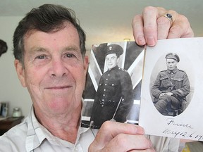 Bob Connor holds up two photos of his father, Bernice Connor, after he joined the army during the First World War. The photo on left was taken in 1915, the one on the right two years later. (Michael Lea/The Whig-Standard)