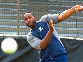 Cleveland Brownlee watches his hit head straight for a photographer crouched behind the pitcher?s protection during batting practice at Labatt Park Wednesday as the Majors get ready for the playoffs. With 11 days off, the Majors have been trying to stay sharp, Brownlee especially. He had been hitting the ball well before the break. (Mike Hensen/The London Free Press)