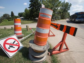 Traffic works its way through a construction zone on Connors Road near Cloverdale Hill in Edmonton, Alta., on Wednesday, Aug. 6, 2014. Organizers of the Edmonton Folk Music Festival, which runs from Aug. 7 - 10, said they were told the construction on the nearby throughfare would be complete by the opening of the festival Thursday. Ian Kucerak/Edmonton Sun/QMI Agency