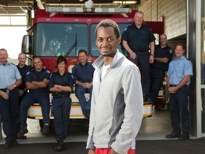 Nkinyam Ngoh happily reunites with a group of Station 7 firefighters in London. On July 27, firefighters discovered a lifeless Ngoh inside his burning townhouse. Ngoh has made such a miraculous and swift recovery that less than two weeks later he visited the crew that saved him. Firefighters are, left to right, Tom Borton, Ben Ladouceur, Matt Hagman, Tina Sirka, Derrick Martin, Randy Geene, Stephen Garrett and John Mark Charlton. (DEREK RUTTAN, The London Free Press)