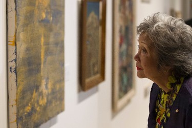 Hon. Colonel-in-Chief PPCLI Adrienne Clarkson looks at paintings at the official opening of Forging A Nation: Canada Goes To War at the University of Alberta Museums Enterprise Square Galleries in Edmonton, Alta., on Wednesday, Aug. 6, 2014. The art exhibition runs through Aug. 16, and coincides with the 100th anniversary of the Princess Patricia's Canadian Light Infantry. Ian Kucerak/Edmonton Sun/QMI Agency