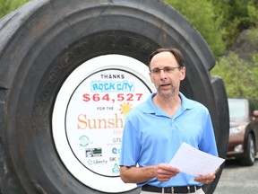 Gino Donato/The Sudbury Star
In May, used tires were collected from garages and yards across Ontario and transformed into something truly extraordinary for children within The Sunshine Foundation of Canada’s network. Between May 26 and May 31, 2014, Ontario residents from across the province dropped off 46,898 tires as part of the fifth annual Tire Take Back event organized by Ontario Tire Stewardship (OTS) and the Ontario Automotive Recyclers Association (OARA). This year’s event raised more than $90,000 for The Sunshine Foundation of Canada, enabling children with life threatening illnesses and severe disabilities to embark on adventures of a lifetime. Locally Rock City Auto Supplies has raised over $64,000 since the program has been in effect for the last five years. Steve Fletcher, Executive Director of the Ontario Automotive Recyclers Association announces the totals at Rock City Auto on Wednesday.