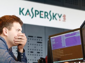 An employee works near screens in the virus lab at the headquarters of Russian cyber security company Kaspersky Labs in Moscow July 29, 2013. REUTERS/Sergei Karpukhin