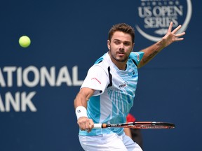 Stan Wawrinka (SUI) hits a backhand against  Kevin Anderson (RSA) on day four of the Rogers Cup tennis tournament at Rexall Centre on Aug 7, 2014 in Toronto, Ontario, Canada. (Peter Llewellyn/USA TODAY Sports)