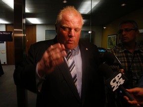 Mayor Rob Ford speaks to the media outside his office on Thursday, Aug. 7, 2014. (JACK BOLAND/Toronto Sun)