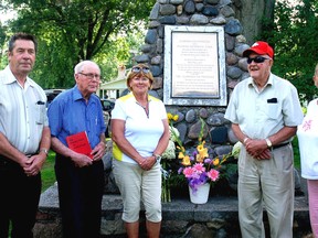 The Old Boys Association at the Port Glasgow Trailer Park last week dedicated the cairn and its plaque to the founders of the park and the pioneers and veterans of the First and Second World Wars on the anniversary of the start of the First World War. At the dedication were West Elgin Coun. Richard Leatham, left, Keith Kelly, one of the original Old Boys; Shari Faryniuk of the Old Boys Association; Gord McFadden, also an Old Boy; and Pauline Durocher of the Old Boys Association.