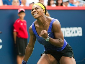 Serena Williams celebrates winning a point against Caroline Wozniacki at the Rogers Cup in Montreal, Aug. 8, 2014. (BEN PELOSSE/QMI Agency)