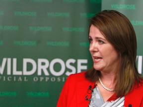 Alberta's WIldrose leader Danielle Smith speaks to media at the party caucus office in Calgary, Alta on Friday August 8, 2014. Jim Wells/Calgary Sun/QMI Agency