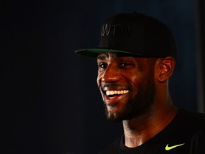 Cleveland Cavaliers forward LeBron James talks with the media during the LeBron James Family Foundation Reunion and Rally at InfoCision Stadium on August 8, 2014. (Andrew Weber/USA TODAY Sports)