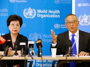 World Health Organization (WHO) Director-General Margaret Chan (L) sits next to Keiji Fukuda, WHO's assistant director general for health security, as he addresses the media after a two-day meeting of its emergency committee on Ebola, in Geneva August 8, 2014. West Africa's raging epidemic of Ebola virus is an "extraordinary event" and now constitutes an international health risk, the WHO said on Friday.  REUTERS/Pierre Albouy