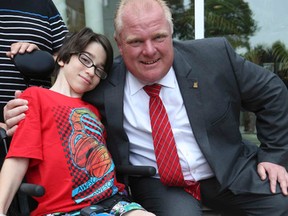 Mayor Rob Ford greets Dominique Dubie, 12, of North Bay, outside of Holland Bloorview Kids Rehabilitation hospital in Toronto on Friday. (VERONICA HENRI/Toronto Sun)