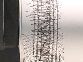 The lines on this cylinder at The University of Manitoba represent seismic activity, in the absence of a seismic event there is one straight line on the paper.  The earthquake in Chile and the afterrshocks  are depicted by the squiggly line.  The device is called a helicorder.