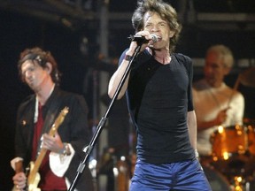 Mick Jagger of the Rolling Stones rocks to a crowd of more than 40, 000 fans at Lansdowne Park in Ottawa on Aug 28, 2005.