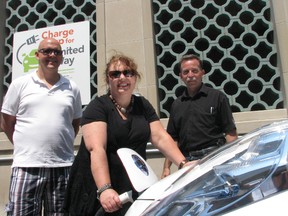 Kelly Gilson, of the United Way, with Jay Heaman of Woodstock Hydro and Jerry O'Connell, group leader of TMMC at the launch of new Charge Up for United Way program on Saturday. HEATHER RIVERS/WOODSTOCK SENTINEL-REVIEW