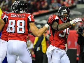 Atlanta Falcons running back Steven Jackson (39) celebrates a touchdown with tight end Tony Gonzalez (88) in the first half at the Georgia Dome on Dec 15, 2013 in Atlanta, GA, USA. (Daniel Shirey/USA TODAY Sports)