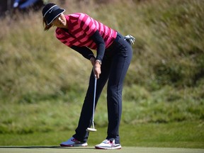 Michelle Wie of the U.S. puts at the 10th hole during the women's British Open golf tournament at Royal Birkdale Golf Club in Southport, northern England, July 11, 2014. (REUTERS/Nigel Roddis)