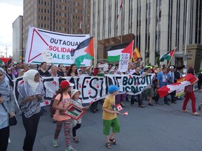 A group of Pro-Palestinians took to the streets Saturday in Ottawa to voice their opposition against Israeli military action. Megan Gillis/Ottawa Sun