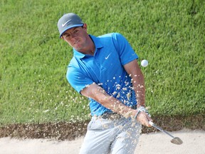 PGA golfer Rory McIlroy hits out of a sand trap on the 14th hole during the third round of the 2014 PGA Championship golf tournament at Valhalla Golf Club on Aug 9, 2014 in Louisville, KY, USA. (Brian Spurlock/USA TODAY Sports)