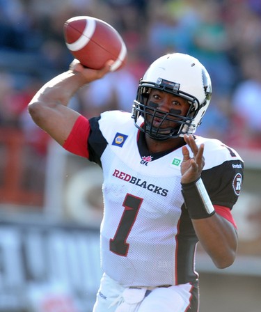QB Henry Burris from the Ottawa Redblacks throws against the Calgary Stampeders during CFL action in Calgary, Alta. on Saturday August 9, 2014. Stuart Dryden/Calgary Sun/QMI Agency