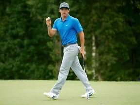 Rory McIlroy of Northern Ireland reacts after saving par on the 11th hole during the third round of the 2014 PGA Championship at Valhalla Golf Club in Louisville, Kentucky, August 9, 2014. (REUTERS/John Sommers II)