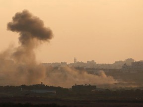 Smoke rises in the Gaza Strip after an Israeli strike as seen from the Israeli border August 9, 2014.  REUTERS/Amir Cohen