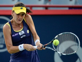 Agnieszka Radwanska (POL) hits a backhand against Ekaterina Makarova (RUS) on day six of the Rogers Cup tennis tournament at Uniprix Stadium on Aug 9, 2014 in Montreal, Quebec, Canada. (Eric Bolte/USA TODAY Sports)