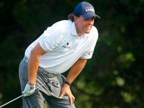 Phil Mickelson of the U.S. watches his drive off the 18th tee during the third round of the 2014 PGA Championship at Valhalla Golf Club in Louisville, Kentucky, August 9, 2014. (REUTERS/Brian Snyder)