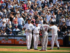 New York Yankees shortstop Derek Jeter (2) receives a standing ovation for his 3431 hit for sole possession of sixth place on baseballs all time hit list during the sixth inning against the Cleveland Indians at Yankee Stadium on Aug 9, 2014 in Bronx, NY, USA. (Anthony Gruppuso/USA TODAY Sports)