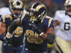 Michael Sam #96 of the St. Louis Rams pass rushes against the New Orleans Saints in a preseason game at the Edward Jones Dome on August 8, 2014 in St. Louis, Missouri.  (Michael B. Thomas/Getty Images/AFP)
== FOR NEWSPAPERS, INTERNET, TELCOS & TELEVISION USE ONLY ==