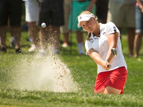 Brooke Henderson plays her third shot on the first hole from a bunker during the afternoon round of 18 of the final round of match play at the 2014 U.S. Women's Amateur at Nassau Country Club in Glen Cove, N.Y. on Sunday, Aug. 10, 2014. Darren Carroll/USGA
