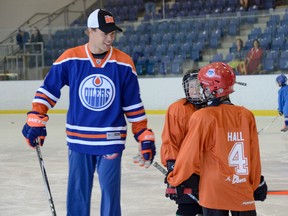 Edmonton Oilers' Taylor Hall chats with a few of the young players during the fourth annual Skate with Taylor Hall Skills Camp on Sunday at the Invista Centre. The fundraising event is presented by James Braden Ford and sees each player raising pledge money that goes to the Children’s Cancer Fund at Kingston General Hospital. (Julia McKay/The Whig-Standard)