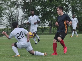 Aaron Hourie of Portage United tries to avoid a defender during Portage's 3-2 win over Winnipeg FC Aug.10. (Kevin Hirschfield/The Graphic)