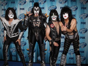 (L-R) Musicians Tommy Thayer, Gene Simmons, Eric Singer, and Paul Stanley of Kiss pose in the press room during Fox's "American Idol" XIII Finale at Nokia Theatre L.A. Live on May 21, 2014 in Los Angeles, California.  (WENN.COM file photo)