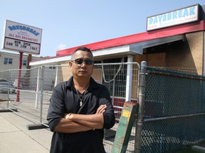 Daysbreak Family Restaurant owner Truong Le stands outside the fire-damaged Sarnia eatery earlier this week. The fire caused an estimated $400,000 damage but Le is hoping to reopen in a few months. (TYLER KULA, The Observer)
