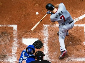 Minnesota Twins Joe Mauer hits an RBI single against the Toronto Blue Jays. REUTERS/Mark Blinch