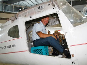 Outgoing Wing Chief Warrant Officer at 8 Wing/CFB Trenton, Ont. Sandor Gyuk “takes off” from the National Air Force Museum of Canada aboard a retired 1959 Cessna 150 with Richard Wagner's 'Ride of the Valkyries' as departure soundtrack, following a change of appointment ceremony there Monday, Aug. 11, 2014. - Jerome Lessard/The Intelligencer