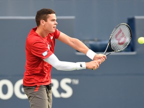 Milos Raonic (CAN) plays a forehand against Feliciano Lopez (ESP) on day five of the Rogers Cup tennis tournament at Rexall Centre. (Peter Llewellyn-USA TODAY Sports)