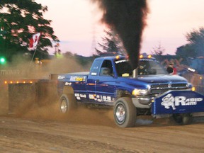 Commanding up to 2,000 horsepower, pro-modified diesel Dodge truck nicknamed Rabid Ram motors down the track during the 2013 edition of the Norwich Optimist Club Truck and Tractor Pull at the Rettie Farm on Evergreen Street. Proceeds from the event, which runs this weekend Aug. 15 and 16, will go to local Optimist programs and projects.