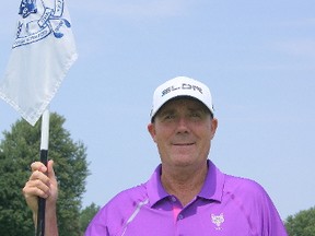 London Hunt and Country Club head golf professional Tim McKeiver holds the flag at hole No. 18. JEFFREY REED\SPECIAL TO THE LONDONER