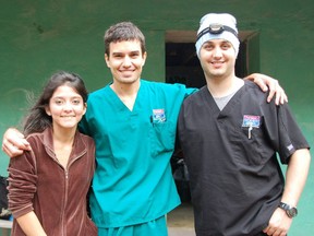 Sarnia native Alan Poole, centre, poses with a Honduran dental student and dentist during a recent mission trip. The 24-year-old University of Detroit Mercy student travelled to the central American country to help provide free dental care to villagers. SUBMITTED PHOTO